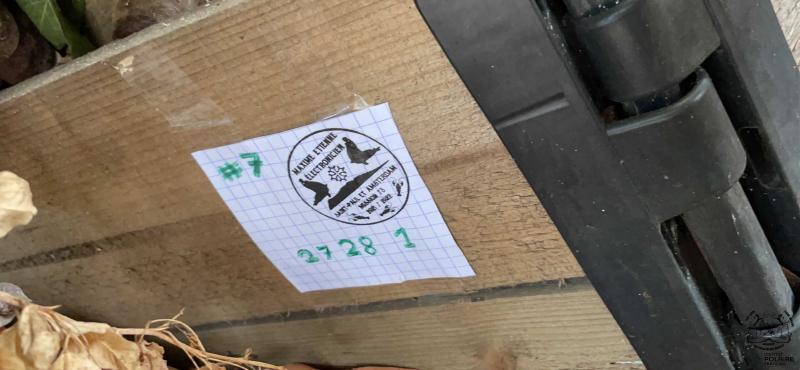 Maxime&rsquo;s stamp hidden behind the composter for the 7th riddle